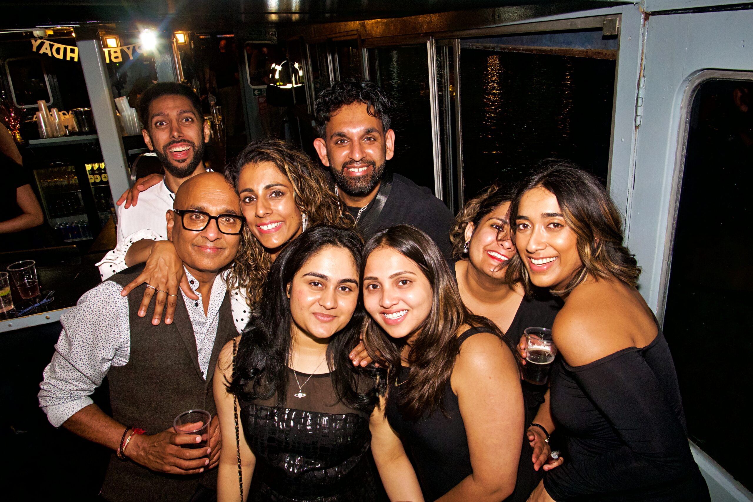 A group of friends enjoying a hen party on a London party boat